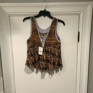 Free People, Sleeveless blouse, size small, color navy combo.  Tag attached.